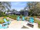 Serene backyard featuring a patio, fire pit, and manicured landscaping at 835 Dyson Dr, Winter Springs, FL 32708
