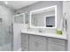 Contemporary bathroom with LED mirror, sleek vanity, and glass-enclosed shower offers a modern spa-like experience at 835 Dyson Dr, Winter Springs, FL 32708