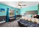 Bedroom with carpet, ceiling fan, and a large window for natural light at 835 Dyson Dr, Winter Springs, FL 32708