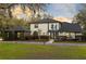 Attractive two-story home showcasing mature landscaping and a welcoming entrance enhanced by exterior lighting at 835 Dyson Dr, Winter Springs, FL 32708