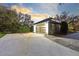 Well lit detached garage with modern door and large parking area at 835 Dyson Dr, Winter Springs, FL 32708