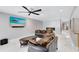 Comfortable living room features a modern fireplace, ceiling fan, and beach scene TV at 835 Dyson Dr, Winter Springs, FL 32708