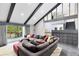 Bright living room featuring a vaulted ceiling and a large sectional sofa at 835 Dyson Dr, Winter Springs, FL 32708