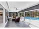 Living area with chairs and view of the screened-in swimming pool at 835 Dyson Dr, Winter Springs, FL 32708
