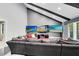 Spacious living room boasts a vaulted ceiling and three large screen televisions at 835 Dyson Dr, Winter Springs, FL 32708