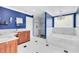 Spacious main bath features marble counters, walk-in shower, and soaking tub at 835 Dyson Dr, Winter Springs, FL 32708