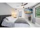 Serene bedroom features a ceiling fan, TV, and window views, creating a peaceful and comfortable retreat at 835 Dyson Dr, Winter Springs, FL 32708
