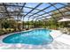 Screened in pool features a beautiful lake view and offers a refreshing escape for relaxation and outdoor enjoyment at 835 Dyson Dr, Winter Springs, FL 32708