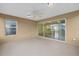 Patio with sliding glass doors and a ceiling fan, offering indoor/outdoor living space at 8602 Se 133Rd Ln, Summerfield, FL 34491