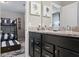 Bathroom featuring granite counters, dark cabinetry, with a view of a bunkbed room at 8892 Bengal Ct, Kissimmee, FL 34747