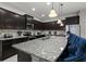 Spacious kitchen with granite countertops, stainless steel appliances, and large island with seating at 8892 Bengal Ct, Kissimmee, FL 34747