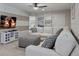 Comfortable living room with a large sofa and TV at 8892 Bengal Ct, Kissimmee, FL 34747