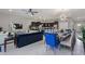 A large open-concept living and dining space featuring modern furniture, a view of the patio and a kitchen at 8892 Bengal Ct, Kissimmee, FL 34747