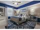 Comfortable primary bedroom featuring a stylish rug, fan, and windows at 8892 Bengal Ct, Kissimmee, FL 34747