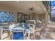 Stylish covered patio with ample seating and dining areas, perfect for outdoor entertaining and relaxation at 8892 Bengal Ct, Kissimmee, FL 34747
