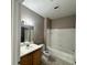 Bathroom featuring tile floor, bathtub/shower and vanity with sink at 9021 Lee Vista Blvd # 1707, Orlando, FL 32829