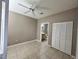 Bedroom featuring a ceiling fan, tile floor and bathroom in view at 9021 Lee Vista Blvd # 1707, Orlando, FL 32829