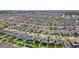 Expansive aerial view of a residential area with rows of single-Gathering homes and manicured lawns at 903 Sydney St, Davenport, FL 33837