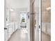 Bright, spacious bathroom featuring double vanity, large shower, and walk in closet at 903 Sydney St, Davenport, FL 33837