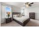 Bedroom with carpet, ceiling fan, dark wood furniture and large windows bringing in natural light at 903 Sydney St, Davenport, FL 33837