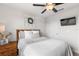 Bright bedroom featuring ceiling fan, decorative wall wreath and medium tone wood accents at 903 Sydney St, Davenport, FL 33837