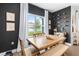 Dining room features modern decor, hardwood flooring, and natural light from the large window at 903 Sydney St, Davenport, FL 33837
