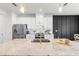 Modern kitchen features white cabinets, stainless steel appliances, and a large island with a sink at 903 Sydney St, Davenport, FL 33837