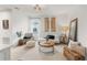 Well-lit living room with carpet, stylish decor, and natural light from the window at 903 Sydney St, Davenport, FL 33837