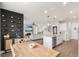 Bright, open-concept living area with view of kitchen island, fireplace, and stairway at 903 Sydney St, Davenport, FL 33837