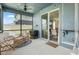 Relaxing screened patio featuring comfortable seating and a view of the home's interior at 903 Sydney St, Davenport, FL 33837