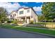 Attractive two-story home with a well-kept lawn and manicured shrubs in a lovely neighborhood at 9330 Meadow Hunt Way, Winter Garden, FL 34787