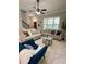 Cozy living room boasting comfortable seating, large windows for natural light, and elegant interior design at 9330 Meadow Hunt Way, Winter Garden, FL 34787