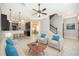 Inviting living room featuring neutral decor, open floor plan, and staircase access at 9330 Meadow Hunt Way, Winter Garden, FL 34787