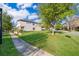 Expansive lawn surrounding a modern two-story home on a sunny day at 9330 Meadow Hunt Way, Winter Garden, FL 34787