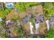 Aerial view showcasing the property, its large lot, and proximity to neighboring homes at 239 S Lake Cortez Dr, Apopka, FL 32703