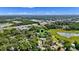 An aerial view of the property and surrounding area, showcasing its location near green spaces at 239 S Lake Cortez Dr, Apopka, FL 32703