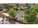 An aerial view of a home surrounded by lush greenery with a defined property line at 239 S Lake Cortez Dr, Apopka, FL 32703
