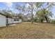 Expansive backyard featuring mature trees and ample space for outdoor activities at 239 S Lake Cortez Dr, Apopka, FL 32703