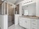 Bathroom features a large shower with granite counters and white vanity at 239 S Lake Cortez Dr, Apopka, FL 32703