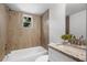 Bathroom with a shower/tub combo with a granite vanity sink and backsplash at 239 S Lake Cortez Dr, Apopka, FL 32703