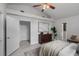 Large bedroom showcasing natural light and a modern ceiling fan at 239 S Lake Cortez Dr, Apopka, FL 32703