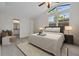 Bright bedroom with vaulted ceilings, large windows, and ensuite bathroom provides a tranquil retreat at 239 S Lake Cortez Dr, Apopka, FL 32703