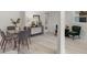 Bright dining area featuring a glass table with seating for six and stylish decor accents at 239 S Lake Cortez Dr, Apopka, FL 32703