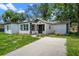 Bright home with new driveway and manicured landscaping at 239 S Lake Cortez Dr, Apopka, FL 32703