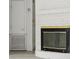 Close up of a white brick fireplace with a black and gold fireplace insert and views into adjoining rooms at 239 S Lake Cortez Dr, Apopka, FL 32703
