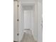 Hallway offers a view of the neutral-toned interior, doors, and modern flooring at 239 S Lake Cortez Dr, Apopka, FL 32703
