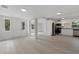 Open concept kitchen featuring stainless steel appliances, white cabinets and modern finishes at 239 S Lake Cortez Dr, Apopka, FL 32703
