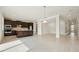 Spacious kitchen features dark cabinets, an island with sink, and stainless steel appliances at 2785 Park Ridge St, Apopka, FL 32712