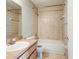 Functional bathroom with tiled walls, a standard tub, and a vanity with sink at 294 San Gabriel St, Winter Springs, FL 32708
