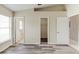 Spacious bedroom with gray vinyl floors and multiple doors leading to closet and bathroom at 294 San Gabriel St, Winter Springs, FL 32708